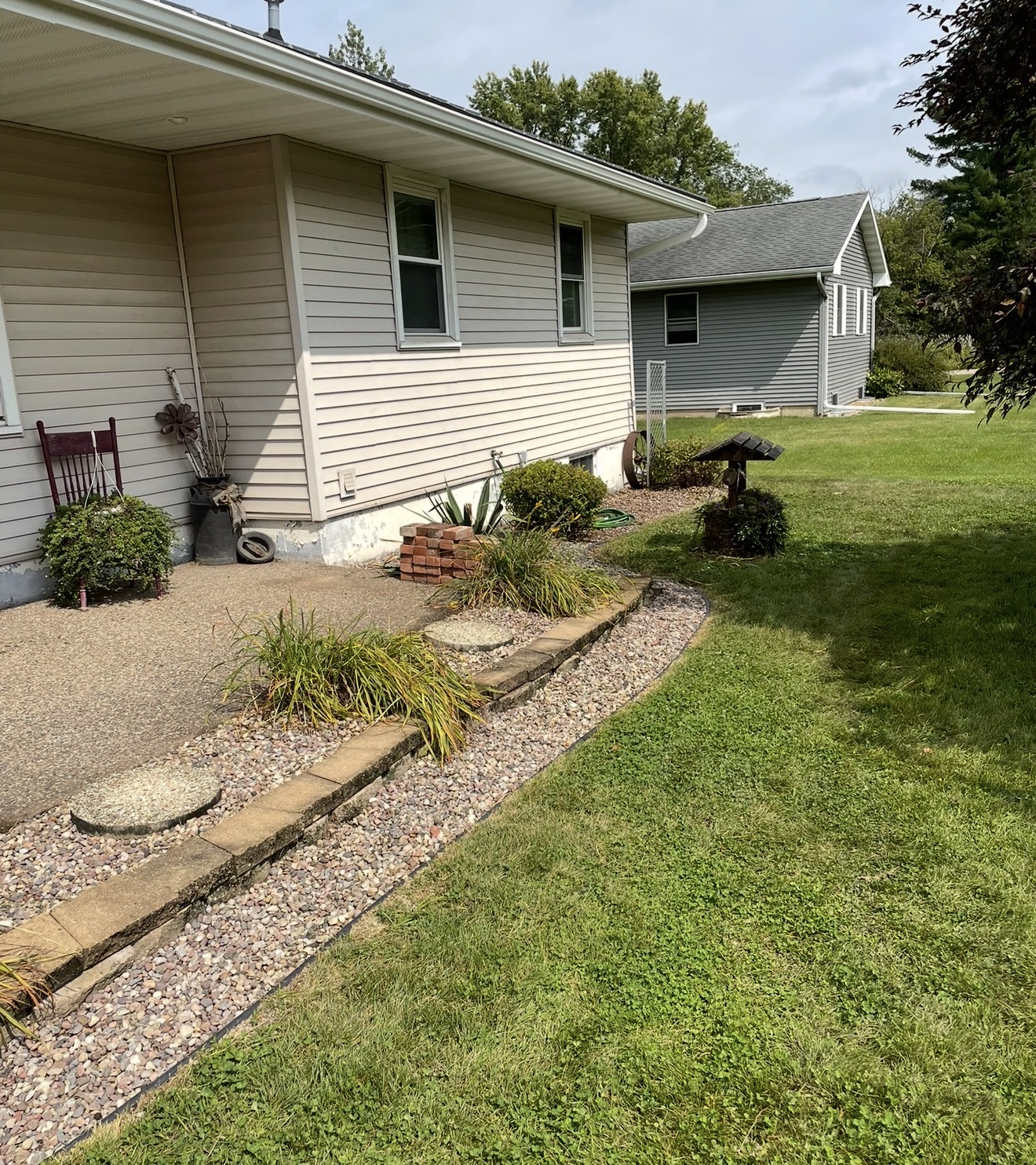 Well-kept property with fresh mulched beds and lawn